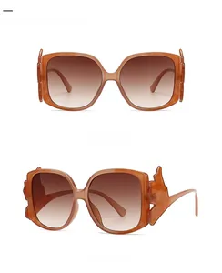 Detailed front and side views of irregular cat-eye sunglasses in gradient coffee tea tint