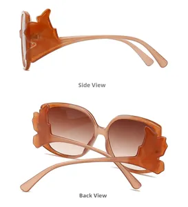 Detail view of stylish oversized orange wave frame sunglasses from side and back angles