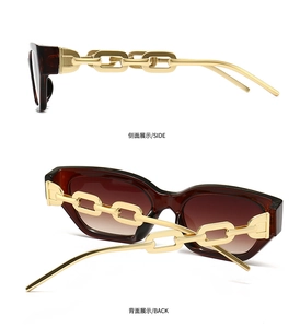 Detail view of square tortoiseshell sunglasses with chunky gold chain temples
