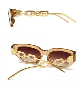 Detail view of amber translucent sunglasses with chunky gold chain-link metal temples