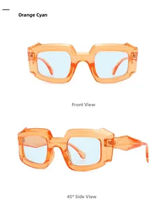 Nahaufnahme der orangefarbenen Polygon-Sonnenbrille mit blauen Gläsern und geometrischen Bügeln