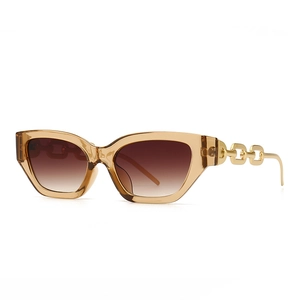 Vintage cat-eye sunglasses with amber frame and golden chain temples on white background