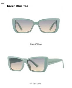 Close-up of butterfly sunglasses in mint green with blue tea gradient lenses