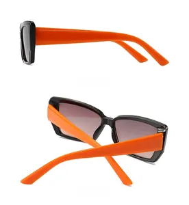 Detailed side and back view of oversized butterfly sunglasses with orange wide temples