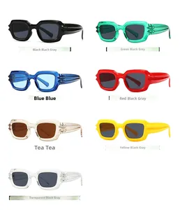 Flat lay of retro geometric wide-frame sunglasses in seven assorted vibrant colors