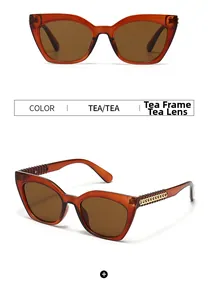 Détail des lunettes de soleil carrées thé avec branches en chaîne dorée et verres thé