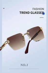Detail of trendy brown gradient lenses and gold metal frame with geometric temple design