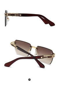 Detail of square oversized frameless sunglasses with gold hollow bridge and gradient lens