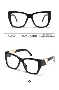 Close-up of black butterfly frame sunglasses with gold triangle hollow temple detail