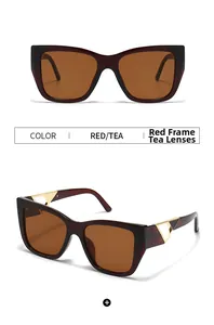 Close-up of red square sunglasses with golden hollow triangle temple hinges and tea lenses