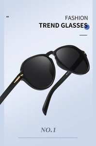 Detail of fashion oversized flat top sunglasses with gold metal accents and UV lenses