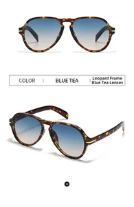 Detail of aviator sunglasses with leopard print frame and blue gradient lenses