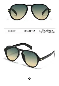Detail of aviator sunglasses with black frame, green tea gradient lenses and gold arrow hinges