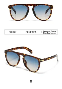 Detail view of tortoiseshell sunglasses with blue tea gradient lenses and metal hinges