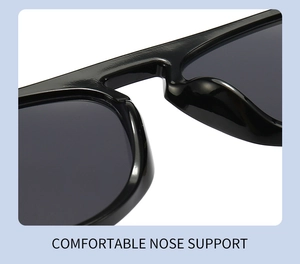 Detail view of comfortable ergonomic nose pads on glossy black 990 sunglasses