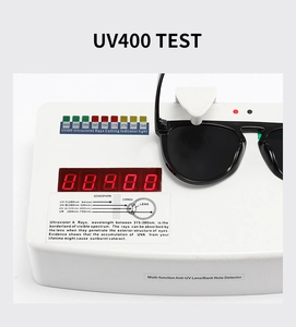 Close-up of black sunglasses undergoing a professional UV400 protection test on a meter