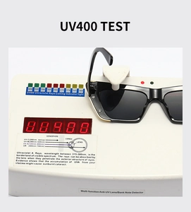 Detail view of black cat-eye sunglasses undergoing a professional UV400 protection test