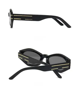 Dettaglio laterale e posteriore degli occhiali da sole cat-eye con accenti dorati