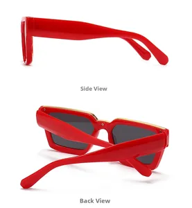 Detail view of red square sunglasses with gold metal bar and dark grey lenses