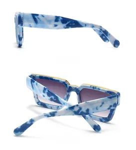 Side and back view of blue marble square sunglasses with gold metal eyebrow trim