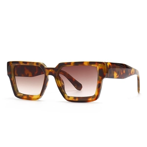 Modern tortoiseshell square sunglasses with brown gradient lenses in a 45-degree side view