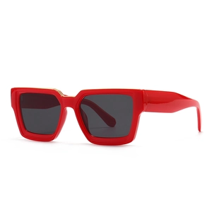 Modern narrow square sunglasses with bold red frames and black lenses for a retro chic look
