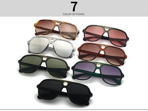 Detail of aviator sunglasses showing diverse lens colors and gold bridge accents