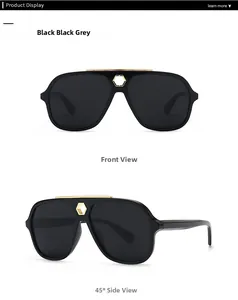 Detail of black aviator sunglasses with gold metal bridge and hexagonal hardware