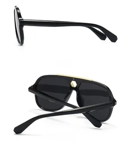 Detail of black aviator sunglasses showing gold metal accents on side and back views
