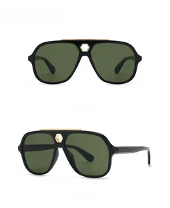 Flat top aviator sunglasses with gold metal bridge accent and dark green lenses