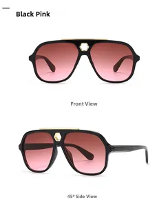 Detail of oversized aviator sunglasses with pink gradient lenses and gold hexagonal accents