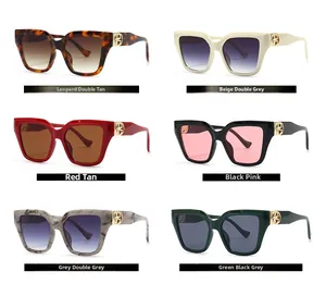 Close-up of square sunglasses collection with gold metal logo and various frame colors