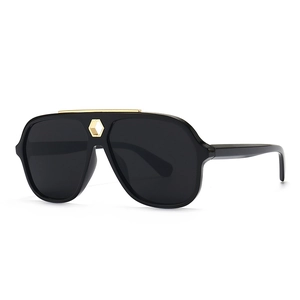 Flat top aviator sunglasses with black frames and gold hexagon metal bridge accent