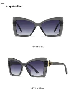 Vue détaillée des lunettes de soleil œil de chat avec monture grise et verres dégradés
