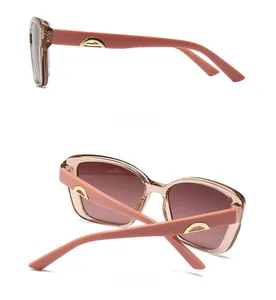 Side and back view of fashion sunglasses with light pink frames and gold metal temple accents