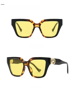 Front and 45-degree side views of large frame hawksbill yellow sunglasses with gold logo