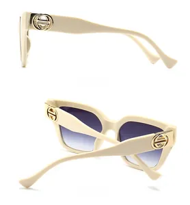 Detailed side and back view of beige oversized sunglasses with gradient purple lenses