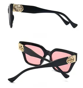 Side and back view of women's black frame sunglasses with transparent pink lenses