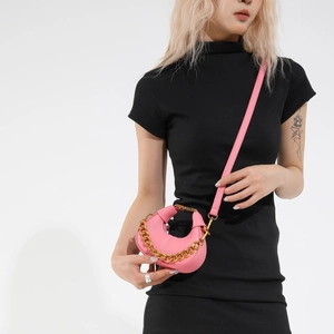 Pink crescent moon handbag with lychee pattern leather and gold chunky chain strap