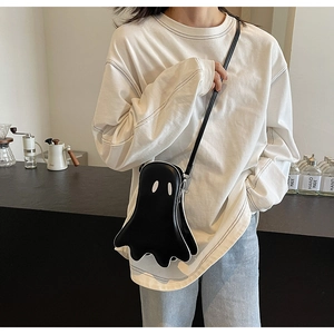 Close-up of the creative ghost-shaped crossbody bag with soft PU material and slim strap