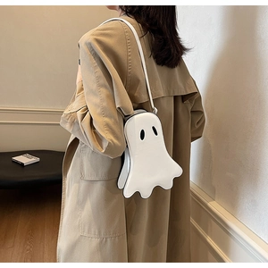 Detail of white cartoon ghost crossbody bag in shiny PU leather for Halloween