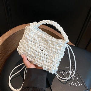 White hand-woven hollow knit crossbody bag with top handle and shoulder strap
