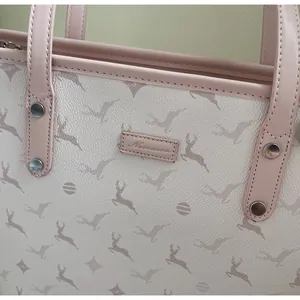 Close-up of premium tote bag with elk print patterns and high-quality leather texture