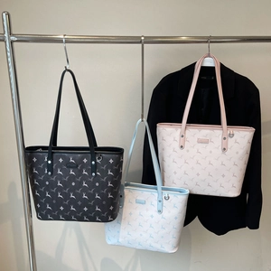 Three premium tote bags in black, light blue, and pink with deer prints and rhombus patterns