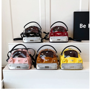 Detailed row of funny car-shaped handbags in five vibrant colors with cartoon cat windows