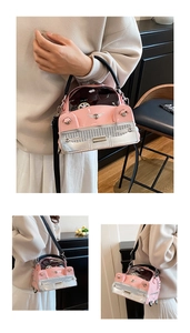 Detail of pink car-shaped handbag featuring a transparent PVC window and silver details