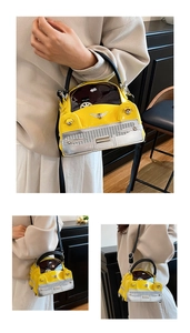 Detail of creative vintage car-shaped handbag with yellow patent finish and silver grille