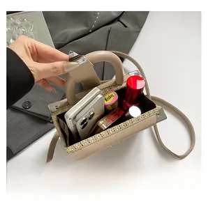 Top view showing the spacious interior of the straw woven box bag for smartphone and lipstick