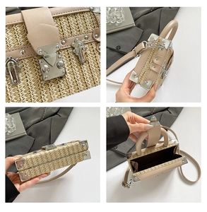 Detail view of woven straw box bag with beige leather trim and silver metal hardware