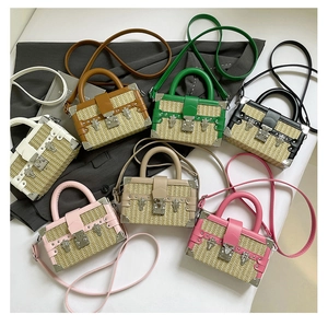 Detailed flat lay of seven colorful woven box bags with leather trim and metal clasps